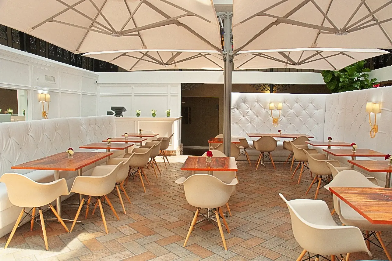 Atrium happy hour seating at The Burgundy