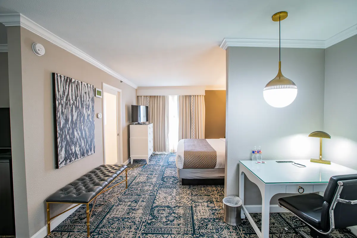 Workspace and bedroom view in a King Studio Suite